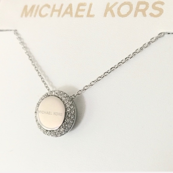 Michael Kors Jewelry - NWT authentic MK Silver tone logo disc necklace